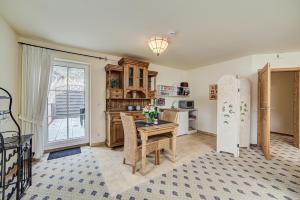 a kitchen with a table and chairs and a kitchen with a window at Landhaus Zimmermann in Alken