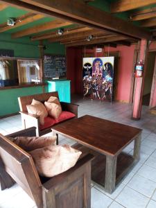 a living room with a table and a couch at La Berendina in Huechulafquen Lake