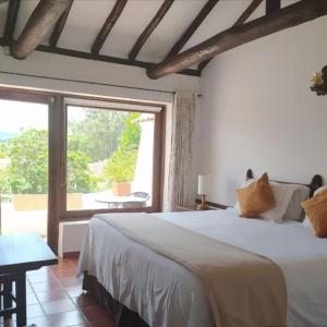 Ένα ή περισσότερα κρεβάτια σε δωμάτιο στο Hotel Mesón de los Virreyes