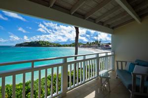 
a view from a balcony of a beach with a view of the ocean at Pineapple Beach Club - All Inclusive Adult Only in Willikies
