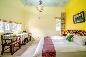 Postel nebo postele na pokoji v ubytování Yi Jing B&B