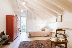 Postel nebo postele na pokoji v ubytování Villa Trisano + 37 fotografií