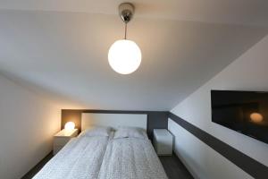 Postel nebo postele na pokoji v ubytování Ferienwohnungen Wiesengrund