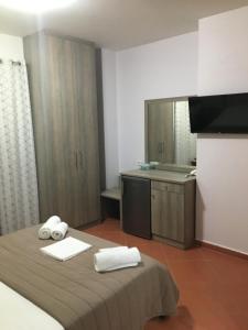 Postel nebo postele na pokoji v ubytování Anesis Hotel