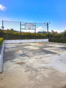 an empty parking lot with a basketball hoop at CASA CAMPESTRE frente Acuarela -Mesa de los Santos in La Granja