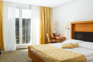 Postel nebo postele na pokoji v ubytování Hotel Vitarium Superior - Terme Krka