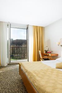 Postel nebo postele na pokoji v ubytování Hotel Vitarium Superior - Terme Krka
