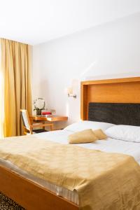 Postel nebo postele na pokoji v ubytování Hotel Vitarium Superior - Terme Krka