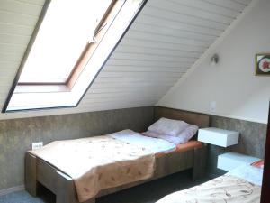 Postel nebo postele na pokoji v ubytování Dunakanyar Apartment