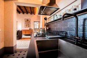a kitchen with a sink and a counter top at Cà Fenice Design in Venice