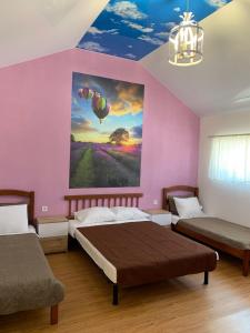 Ліжко або ліжка в номері Guest House Shafran