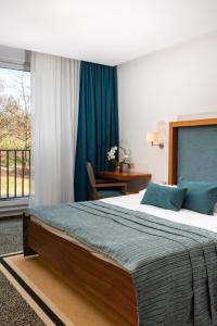 Postel nebo postele na pokoji v ubytování Hotel Vitarium Superior - Terme Krka