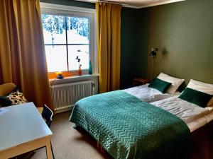 Ένα ή περισσότερα κρεβάτια σε δωμάτιο στο Villa Bergli