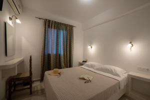 Voodi või voodid majutusasutuse Aphrodite Hotel & Apartments toas