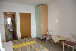 Postel nebo postele na pokoji v ubytování Apartments Davor & Marija Sosic