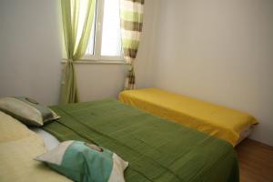 Postel nebo postele na pokoji v ubytování Apartments Davor & Marija Sosic