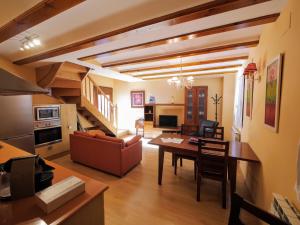 a living room with a couch and a table at Apartamentos Casa Cecilia in San Juan de Plan