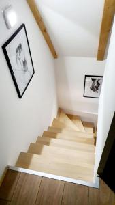 a staircase in a house with two pictures on the wall at Villa Mila 