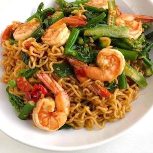 a plate of noodles with shrimp and vegetables at Sweet Time Bungalows in Koh Rong Sanloem