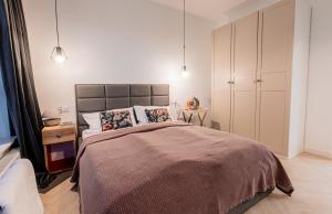 Posteľ alebo postele v izbe v ubytovaní E&A Royal Luxury Apartments, Bydgoszcz - SKYLINE