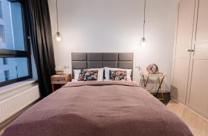 Posteľ alebo postele v izbe v ubytovaní E&A Royal Luxury Apartments, Bydgoszcz - SKYLINE