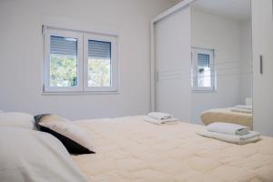 Ένα ή περισσότερα κρεβάτια σε δωμάτιο στο Villa Naklice