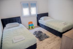 Postel nebo postele na pokoji v ubytování Villa Naklice