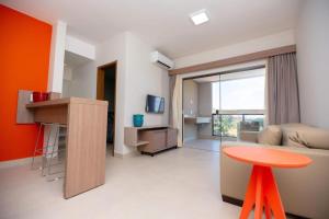 a living room with a couch and a table at ALTA VISTA THERMAS RESORT in Caldas Novas