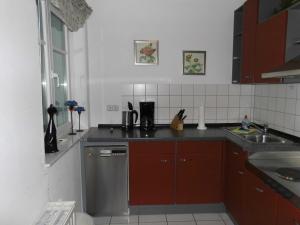 a kitchen with a sink and a dishwasher at 54 Appartement Residenz Bellevue U in Zinnowitz