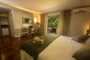 Cama ou camas em um quarto em Grand Carimã Resort & Convention Center