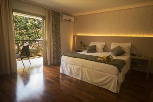 Cama ou camas em um quarto em Grand Carimã Resort & Convention Center