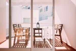 a dining room with a table and chairs at Ponta Branca Beach House in Odeceixe