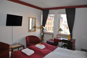 Postel nebo postele na pokoji v ubytování Solsta Hotell