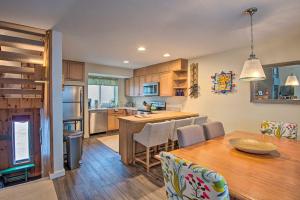 a kitchen and dining room with a table and chairs at Loon Mountain Condo with Pool and Game Room Access! in Lincoln