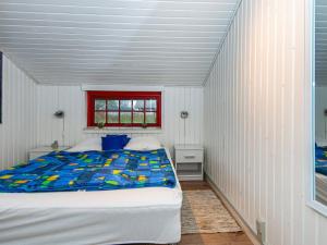 Llit o llits en una habitació de Three-Bedroom Holiday home in Sydals 2
