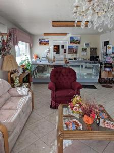 a living room with a couch and a table at Aquarius Inn in Bicknell