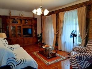 TV a/nebo společenská místnost v ubytování Casa do Paço