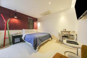 Un ou plusieurs lits dans un hébergement de l'établissement Hotel Myeongjak