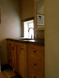 a kitchen with a sink and a window at B&B Saint-Sauveur Bruges in Bruges