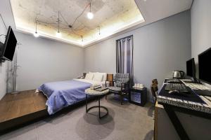 Un ou plusieurs lits dans un hébergement de l'établissement Hotel Myeongjak