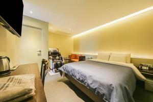 Un ou plusieurs lits dans un hébergement de l'établissement Hotel Myeongjak