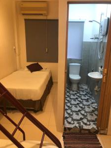 Ett badrum på Bukit Bentong Homestay