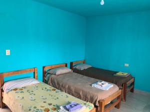 Postel nebo postele na pokoji v ubytování Hostal CASA DE PIEDRA