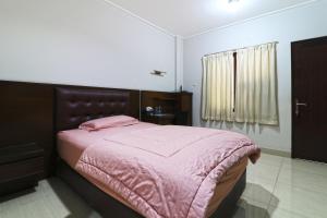 Postel nebo postele na pokoji v ubytování Bendungan Hilir Residence