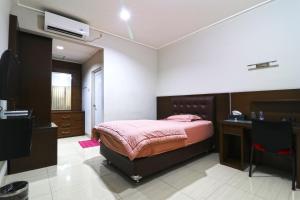Postel nebo postele na pokoji v ubytování Bendungan Hilir Residence