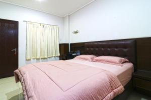 Postel nebo postele na pokoji v ubytování Bendungan Hilir Residence