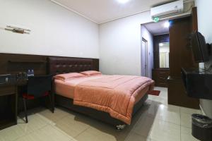 Postel nebo postele na pokoji v ubytování Bendungan Hilir Residence