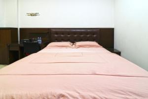Postel nebo postele na pokoji v ubytování Bendungan Hilir Residence