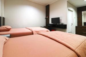 TV a/nebo společenská místnost v ubytování Bendungan Hilir Residence