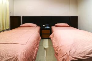 Postel nebo postele na pokoji v ubytování Bendungan Hilir Residence